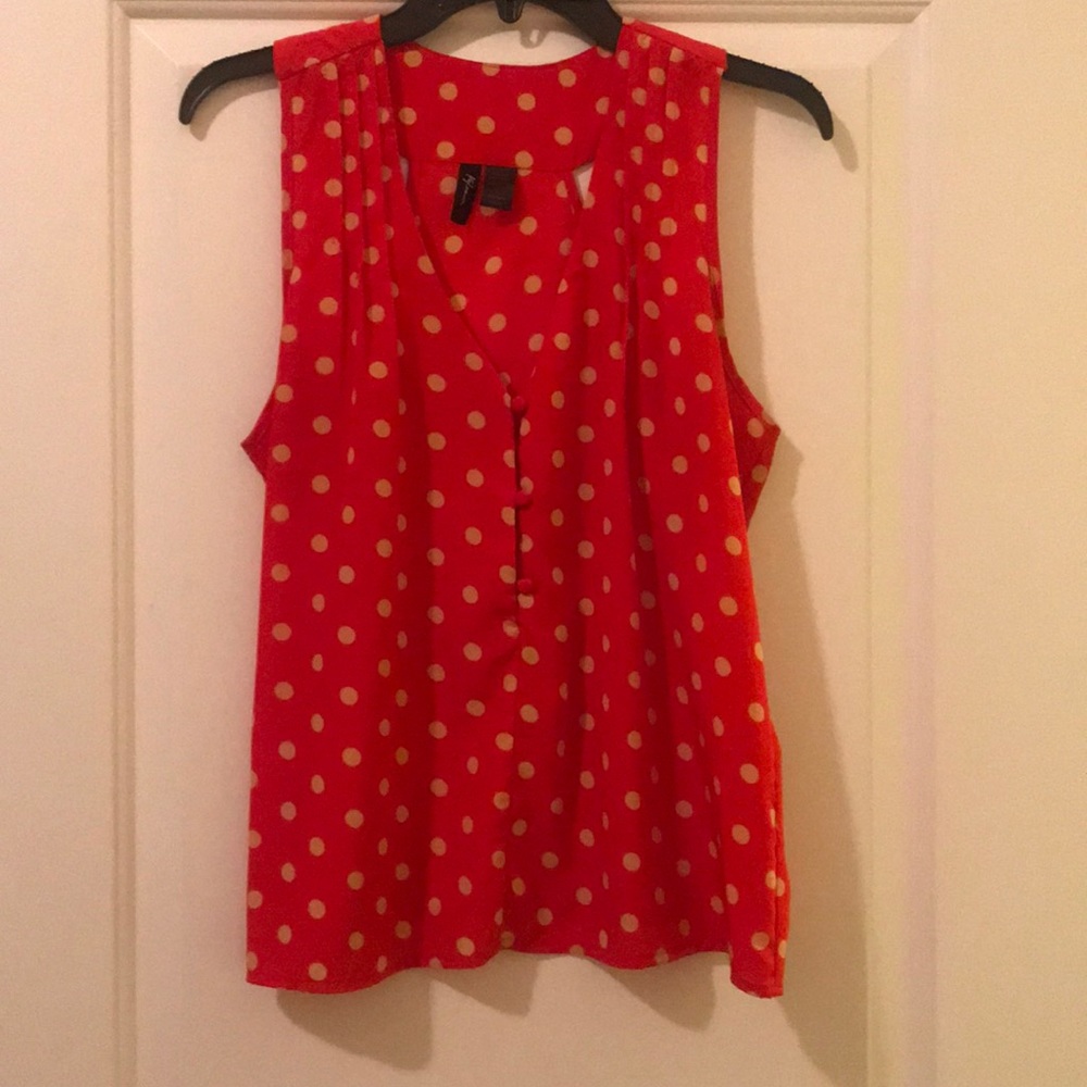 Burnt orange and tan polka dot sleeveless blouse